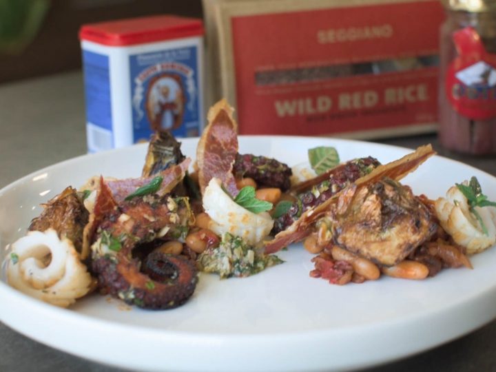 SAUTEED OCTOPUS AND CALAMARI with Jamon Iberico, Roasted Artichoke Salsa Verde, Wild Red Rice and Beans